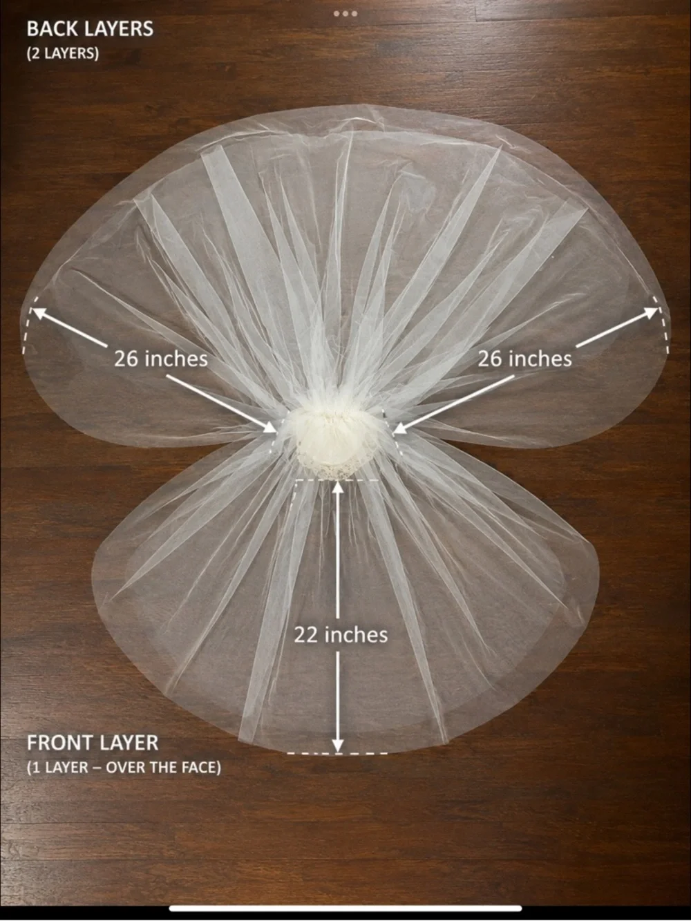 Vintage ivory bridal veil with pill hat and lace-trimmed comb.